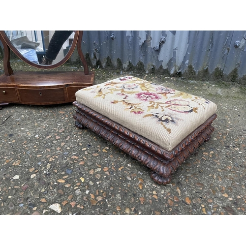 59 - A victorian swing mirror together with two tapestry footstools