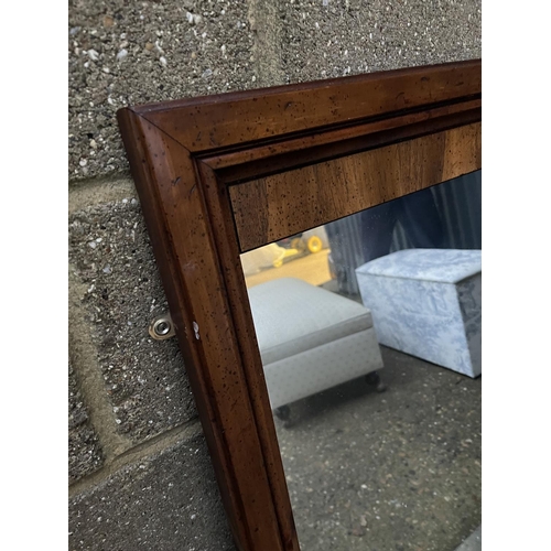 62 - A continental style walnut framed  mirror 65x112