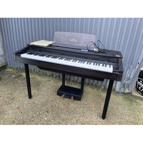 63 - A yamaha clavinova CVP 7 electric piano with instructions