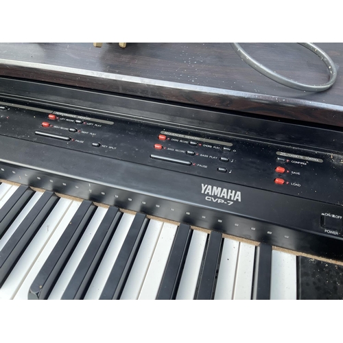 63 - A yamaha clavinova CVP 7 electric piano with instructions