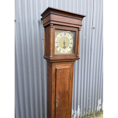 66 - An oak cased lomg case with brass dial by GODEN WEST MALLING