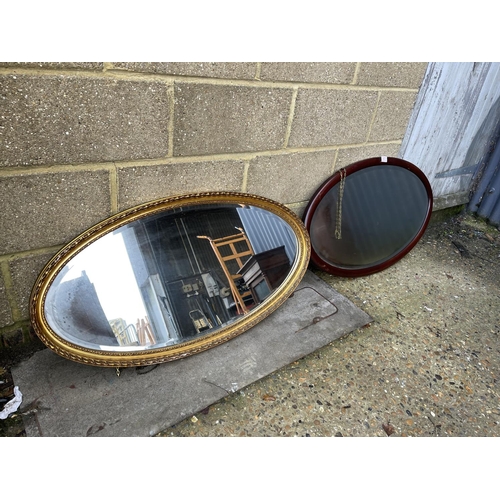 67 - Two oval wall hanging mirrors