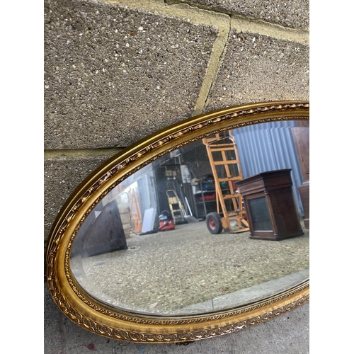 67 - Two oval wall hanging mirrors