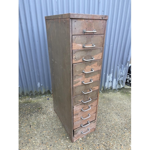 77 - A vintage bank of 11 workshop drawers