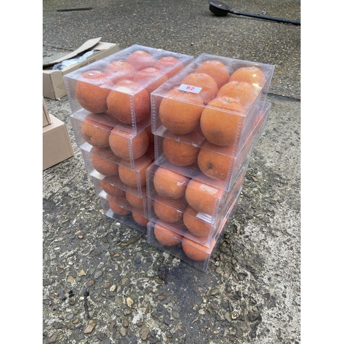 82 - 10 boxes of six artificial glittered oranges