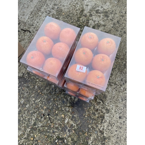 82 - 10 boxes of six artificial glittered oranges