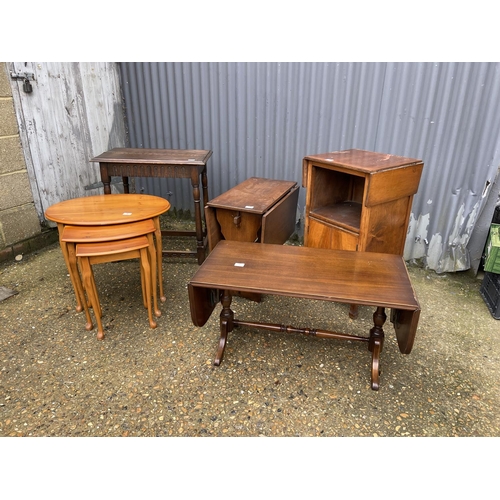 9 - A repro nest of three, coffee table, book table, drop leaf and an oak table