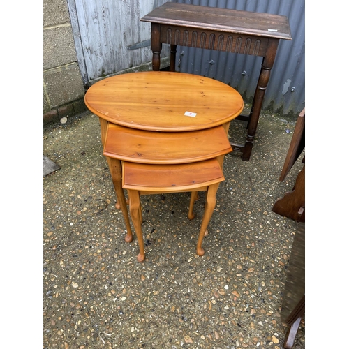 9 - A repro nest of three, coffee table, book table, drop leaf and an oak table