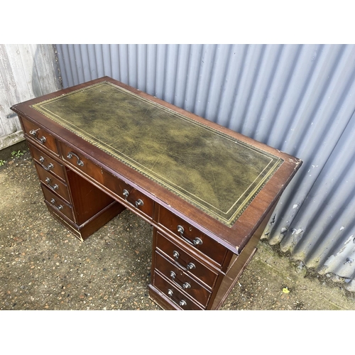 1 - A reproduction mahogany twin pedestal desk