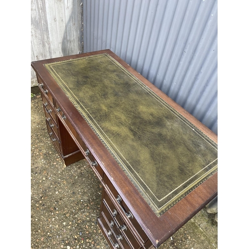 1 - A reproduction mahogany twin pedestal desk