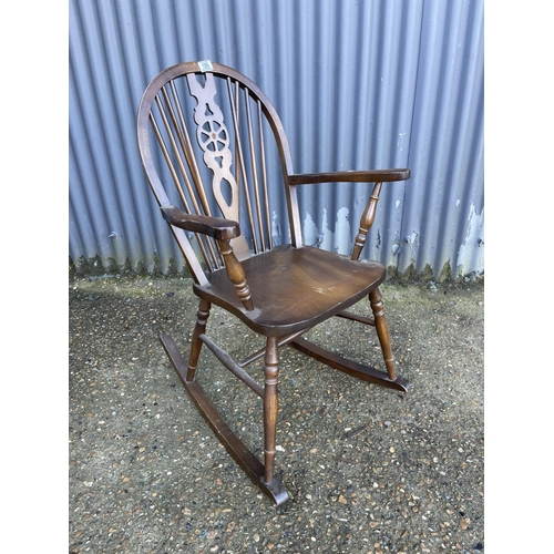 106 - A wheelback rocker chair