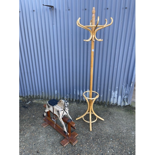 111 - A small vintage rocking horse together with bentwood coat stand