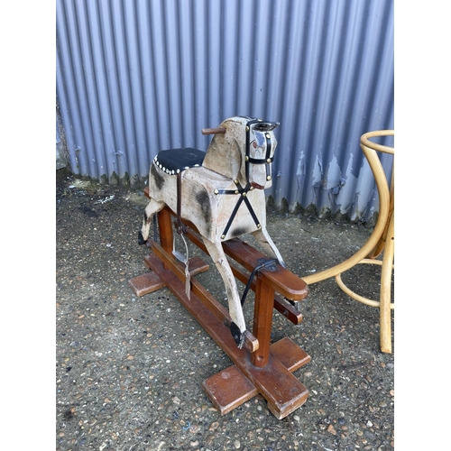 111 - A small vintage rocking horse together with bentwood coat stand