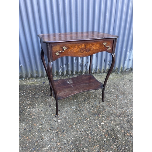 132 - An inlaid french mahogany table with inlaid top