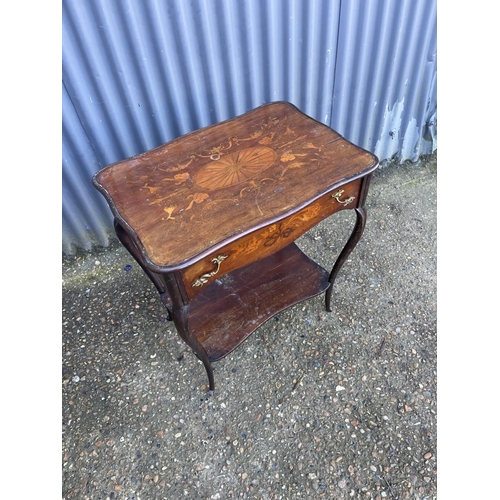 132 - An inlaid french mahogany table with inlaid top