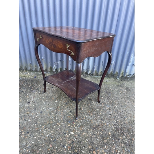 132 - An inlaid french mahogany table with inlaid top