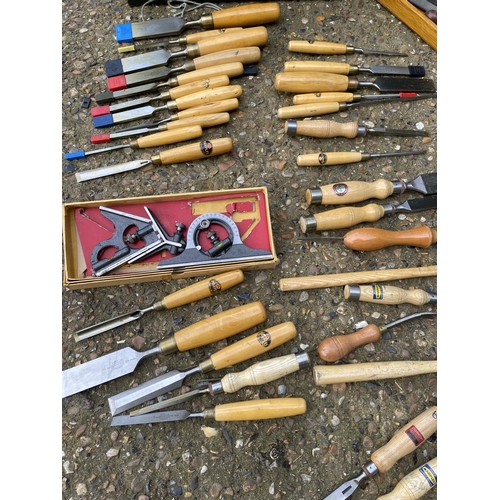 15 - A green tool box containing an assortment of marples chisels