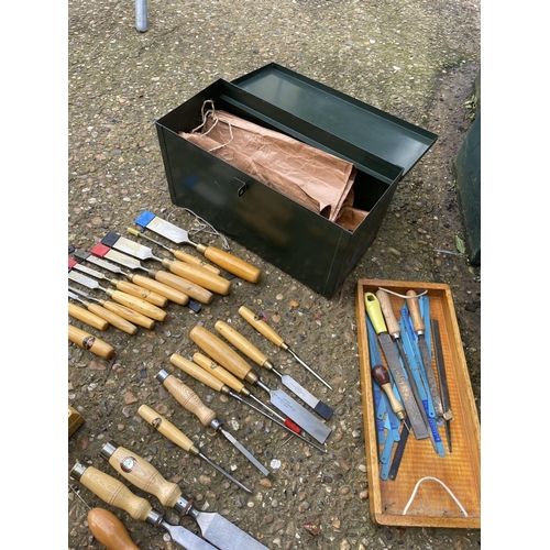 15 - A green tool box containing an assortment of marples chisels