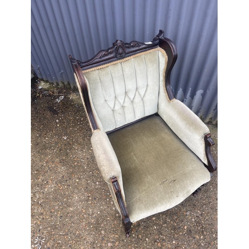 154 - An Edwardian green upholstered salon chair