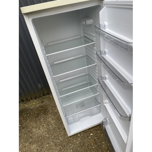 162 - An upright larder fridge