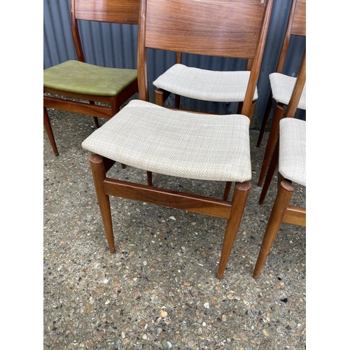 167 - A set of five mid century teak chairs with drop in seats