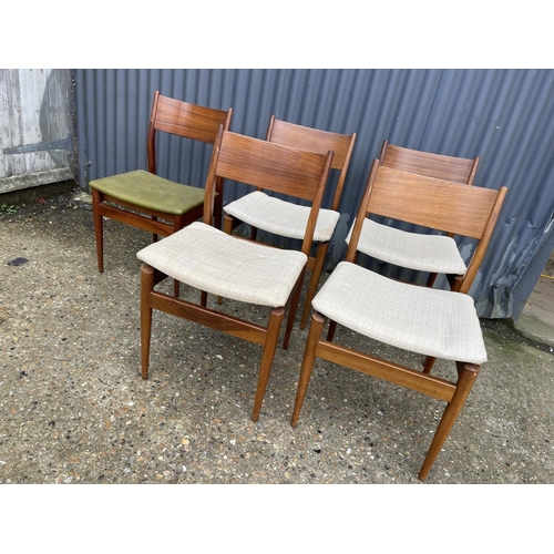 167 - A set of five mid century teak chairs with drop in seats