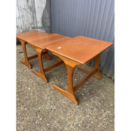 170 - A teak nest of three tables