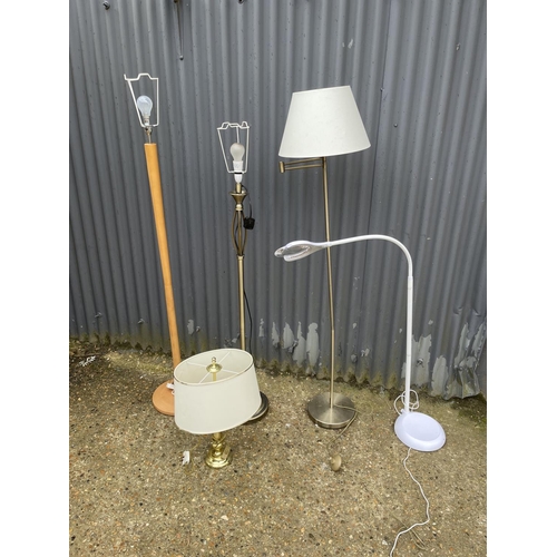 174 - Three floor lamps, magnifier lamp and a table lamp