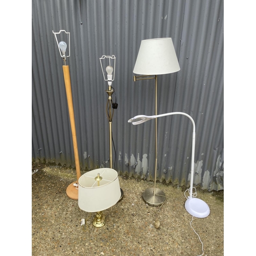 174 - Three floor lamps, magnifier lamp and a table lamp