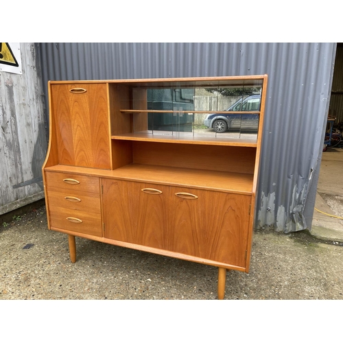 175 - A teak high back cocktail sideboard