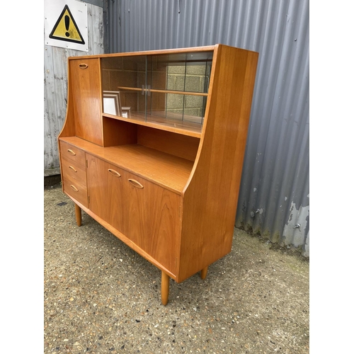 175 - A teak high back cocktail sideboard