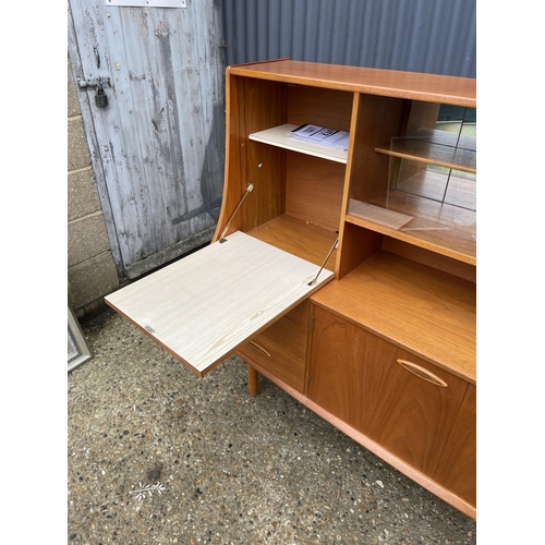 175 - A teak high back cocktail sideboard