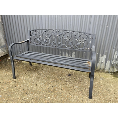 179 - A black metal garden bench