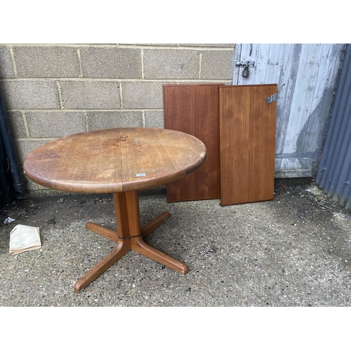 188 - A danish teak extending dining table with two leaves