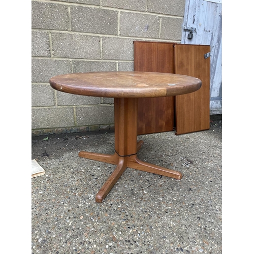 188 - A danish teak extending dining table with two leaves