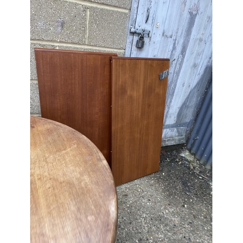 188 - A danish teak extending dining table with two leaves