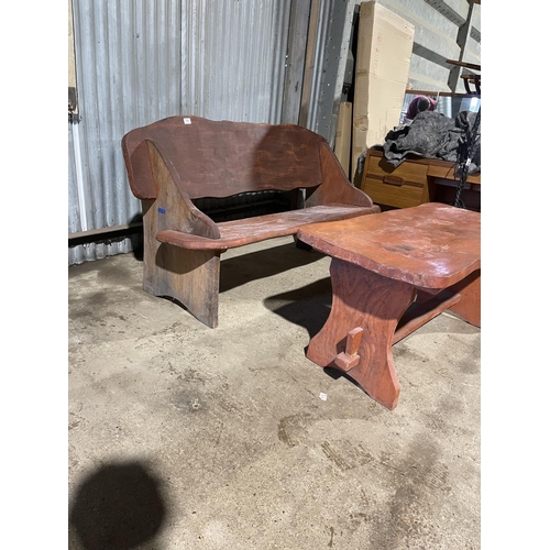 195 - A rustic style wooden garden bench and matching table