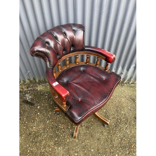 2 - A red leather chesterfield captains swivel chair