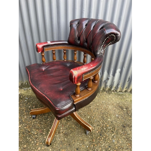 2 - A red leather chesterfield captains swivel chair