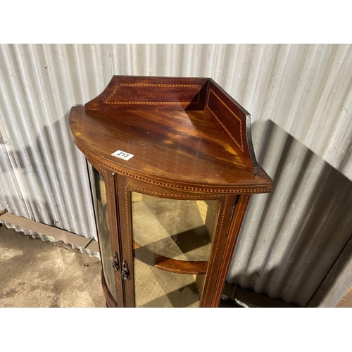 213 - An Edwardian inlaid mahogany glazed bow fronted cabinet