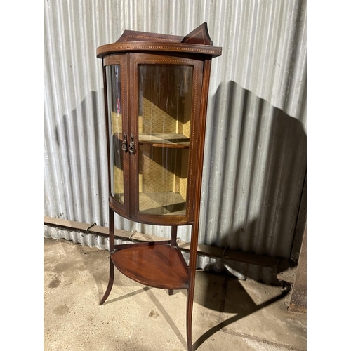 213 - An Edwardian inlaid mahogany glazed bow fronted cabinet