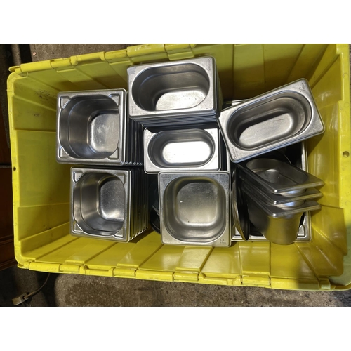 223 - A large crate containing stainless steel serving dishes and pans