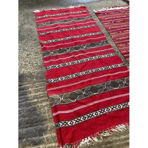 224 - Two red pattern killem style rugs 160x67