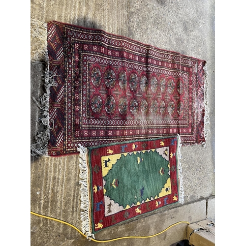 225 - A worn red oriental pattern rug 167x70 together with a small red and green pattern rug