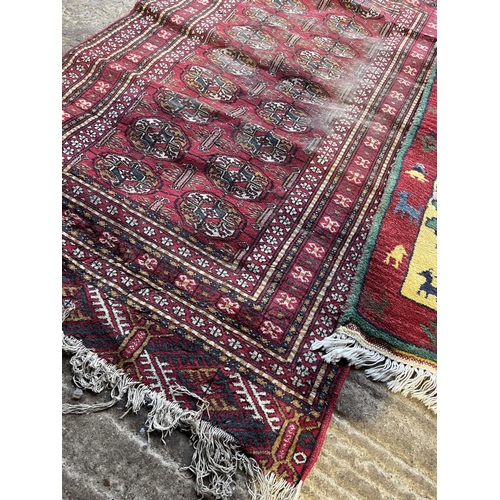 225 - A worn red oriental pattern rug 167x70 together with a small red and green pattern rug