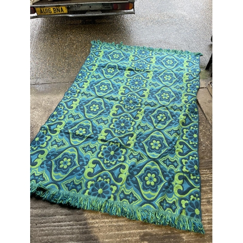 228 - A retro blue and green pattern rug sixe 6' x 8 '