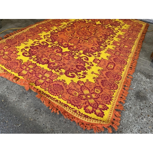 229 - A bright red and yellow pattern rug 300x190