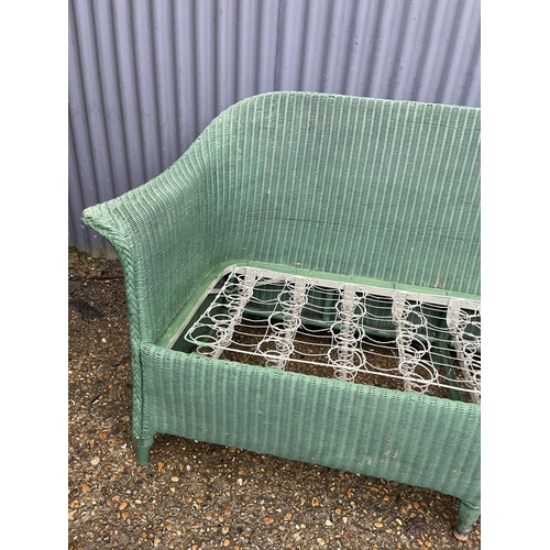 257 - A green lloyd loom sofa