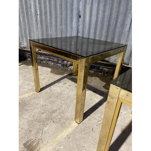 26 - A pair of Italian style brass lamp tables with smoked glass tops 50x50 x50