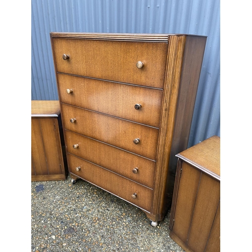 261 - An early 20th century oak tallboy chest together with pair of matching bedsides